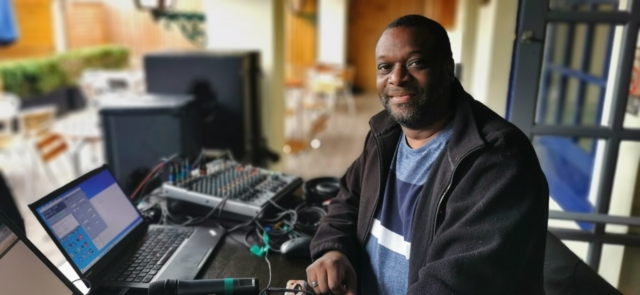 Technical and Sound guy Gehric Barreau on the control desk at The Barratts